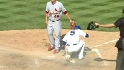 Cedeno scores on wild pitch