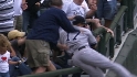 Hairston tumbles into stands