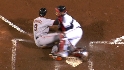 McCann blocks the plate