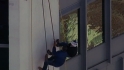 Cashman rappels down building