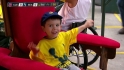 Young fan poses on a throne