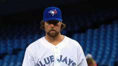 Dickey's knuckleball cooperates, but back does not