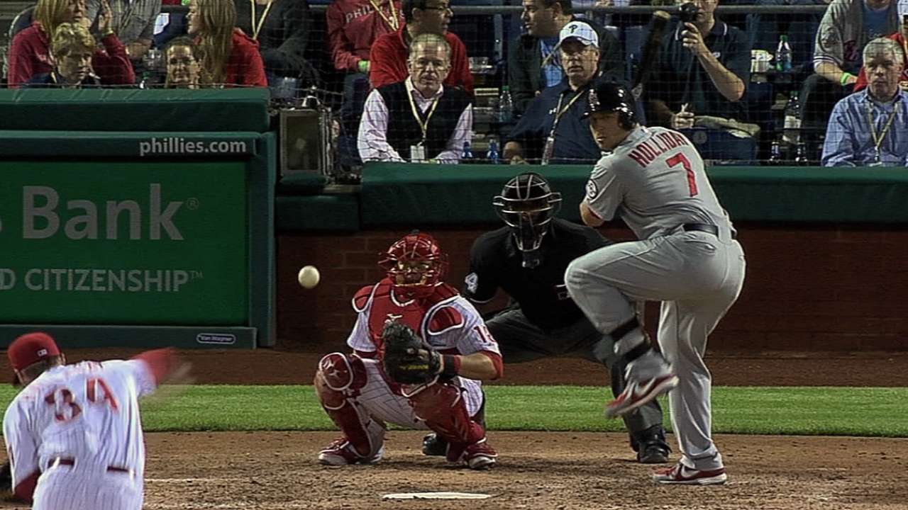 Garcia struggles; Cardinals fall in rain-shortened game
