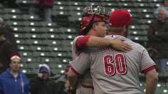 Reds break out of offensive funk, survive late rally