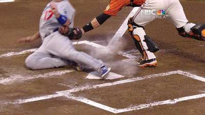 Posey shrugs off eventful night at home plate