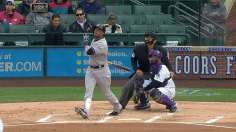 Cano, bullpen steer Yankees' wet win over Rockies