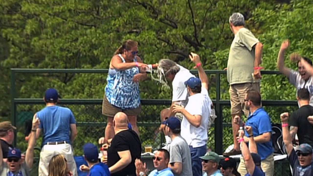 Man spills beer on wife, who reciprocates in kind