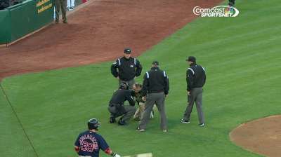 Home-plate umpire exits after getting hit in mask