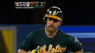 Reddick's three home runs help A's cruise in Canada