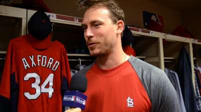 Axford picks up win, gets warm reception in return