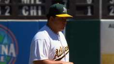 A's unleash seven-run inning to back Colon