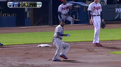 Puig off and running in first taste of postseason