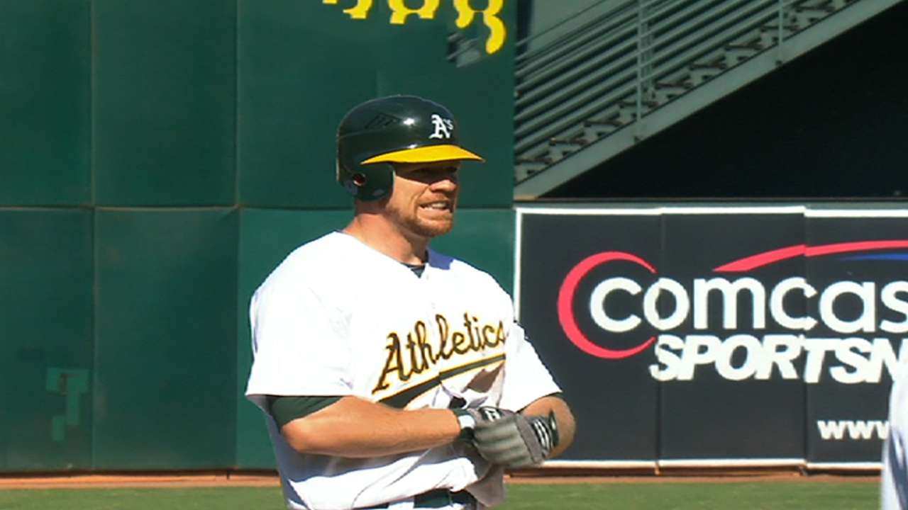 A's avoid arbitration, agree with Moss, Blevins