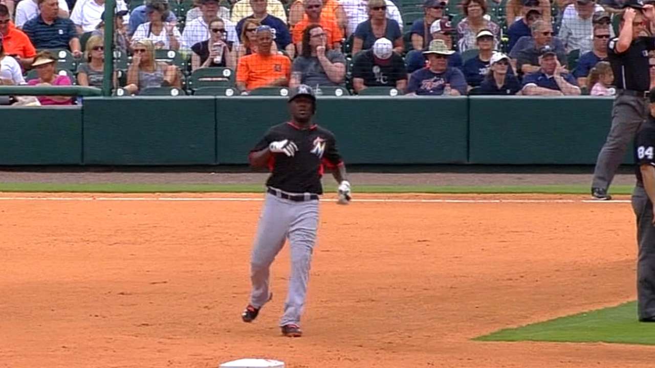 While competing for roster spot, Ozuna sustains cramp