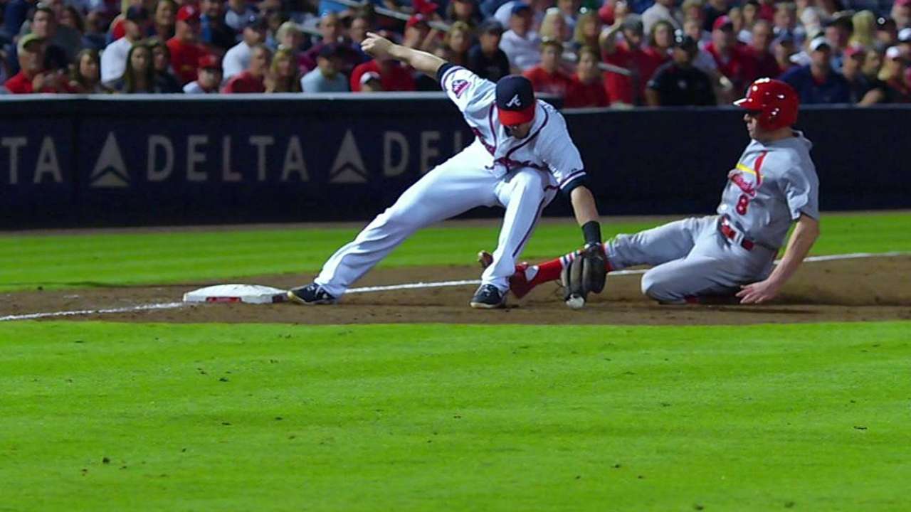 Braves challenge, get call overturned to save run
