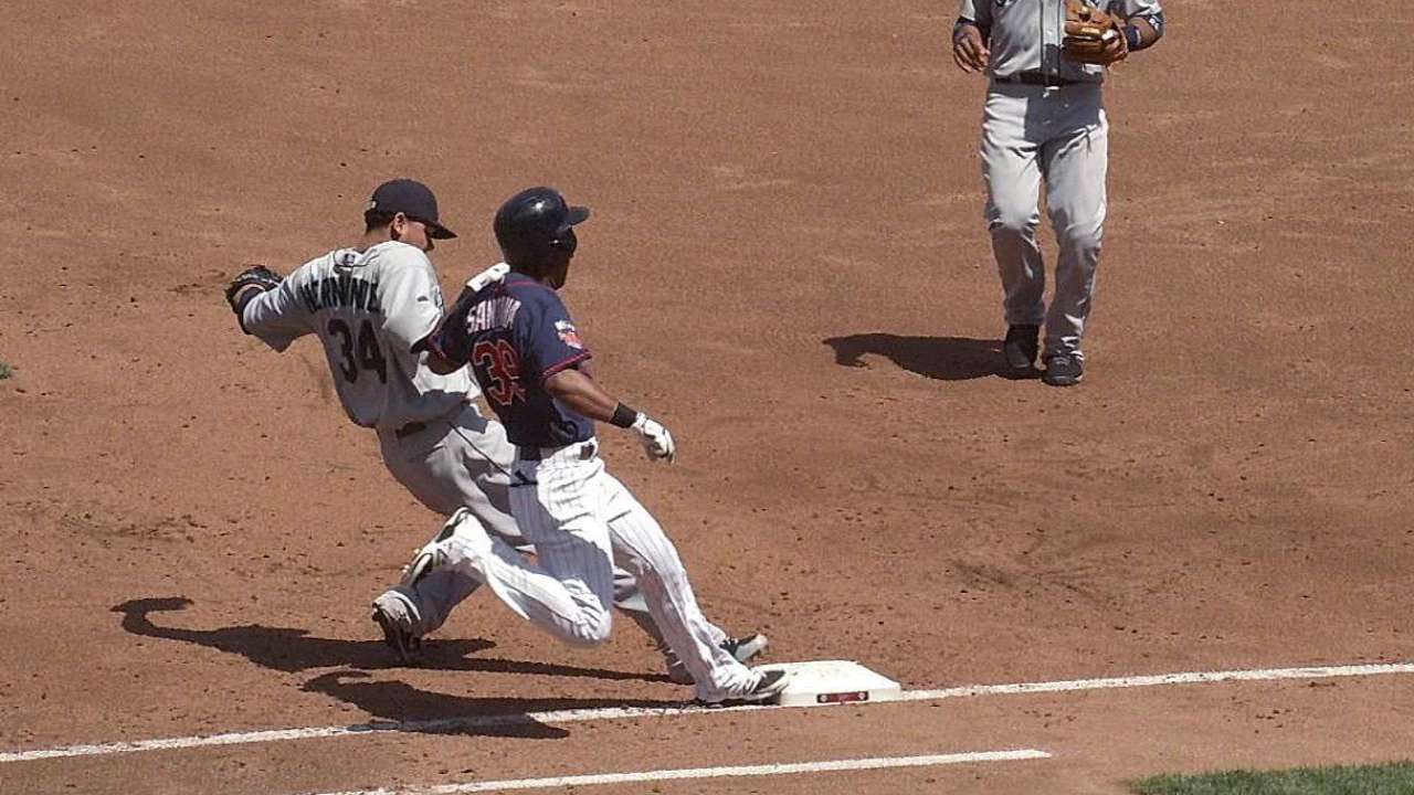 Santana ruled safe after challenge, later scores
