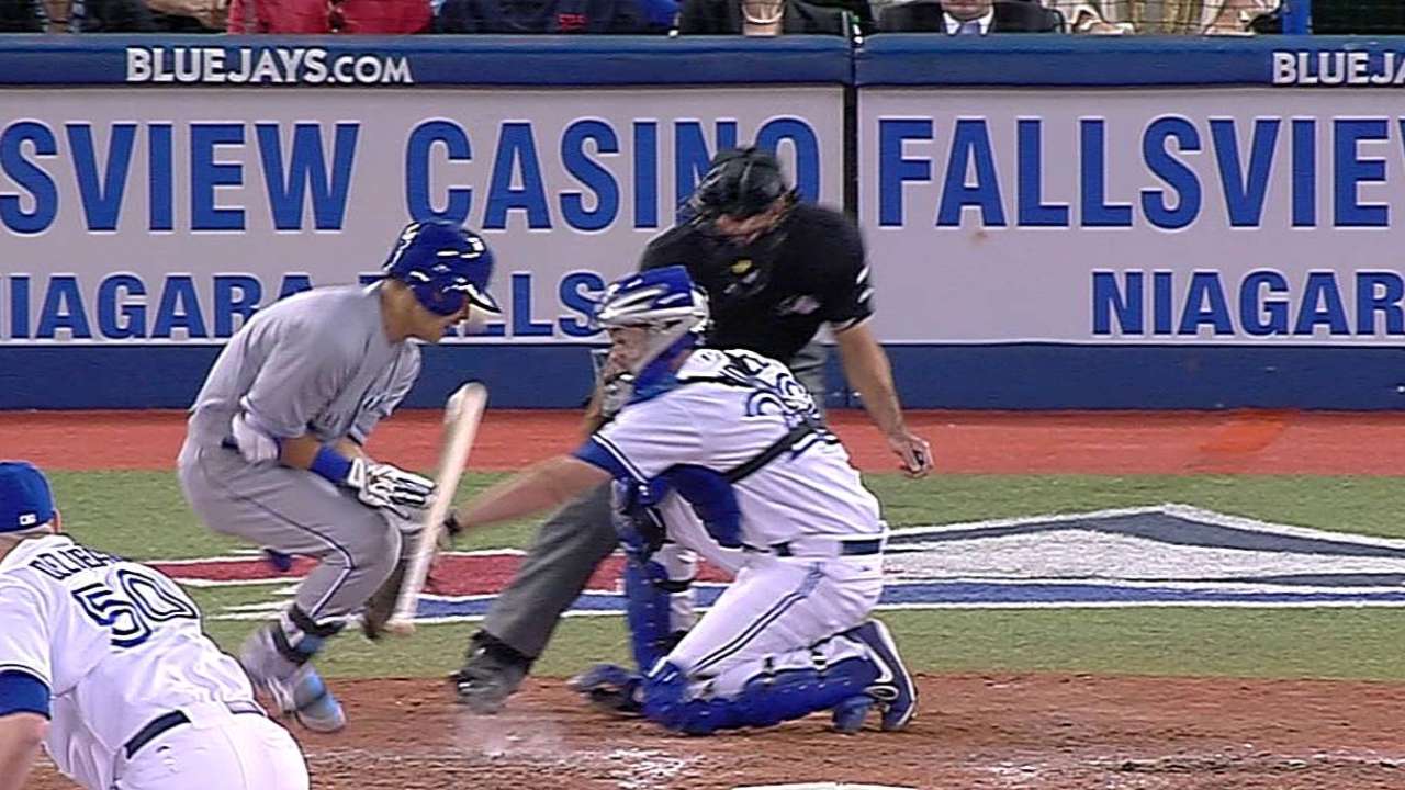Royals go 1-1 on challenges in tilt with Jays
