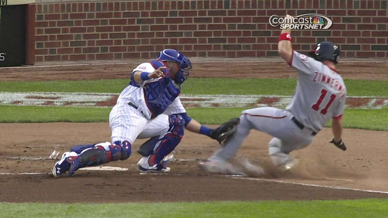 Review supports Cubs catcher on play at plate