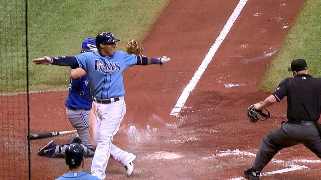 Escobar scores on play at plate after review