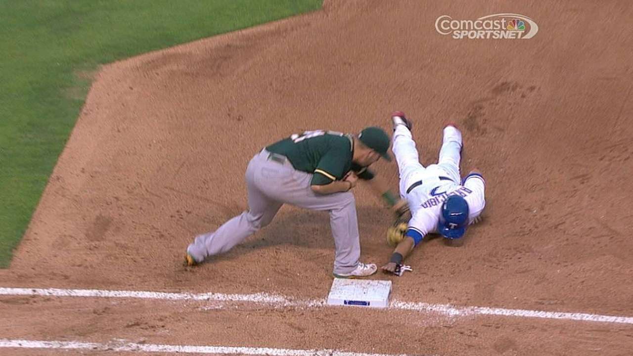A's win challenge on Hammel's pickoff play of Arencibia