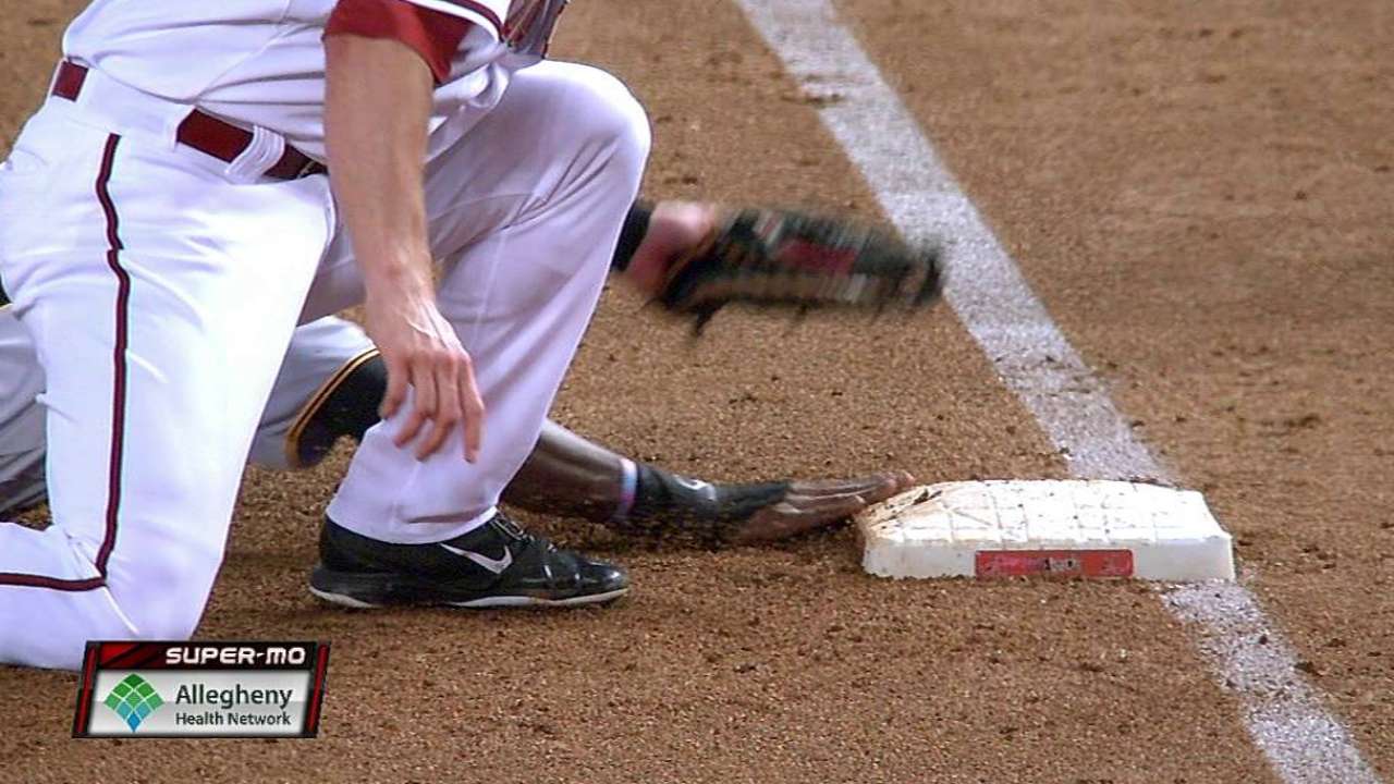 Pirates win challenge to erase pickoff at first