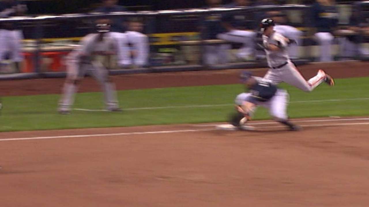 Overturned call seals Brewers' victory in ninth