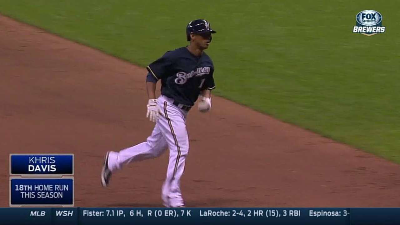 Davis rests sore elbow, homers off bench