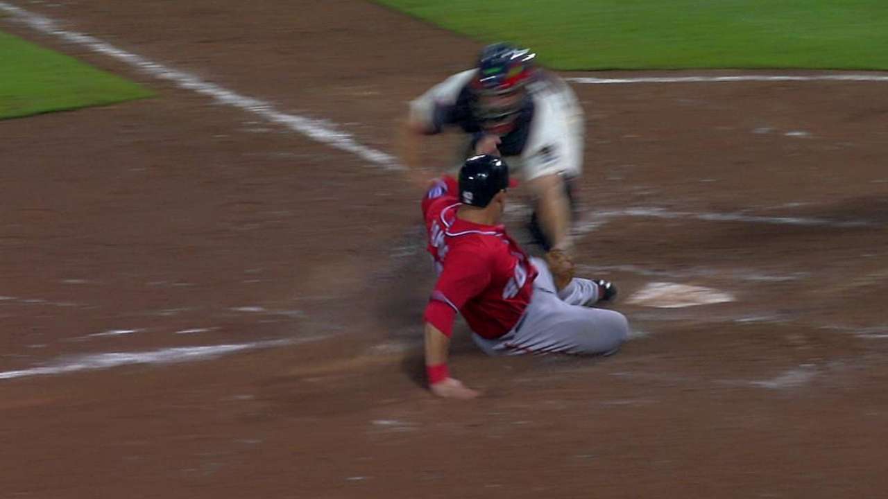 Play at plate overturned after Gonzalez's challenge