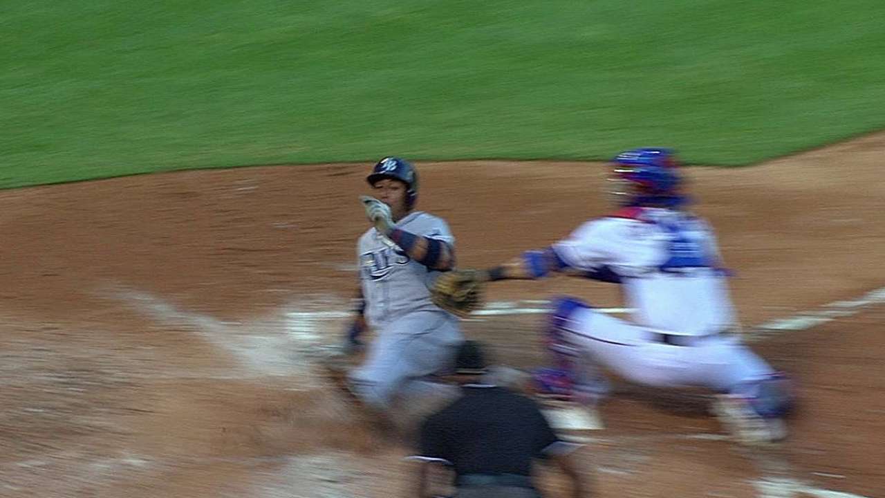 Rays' Escobar out at home plate; call stands