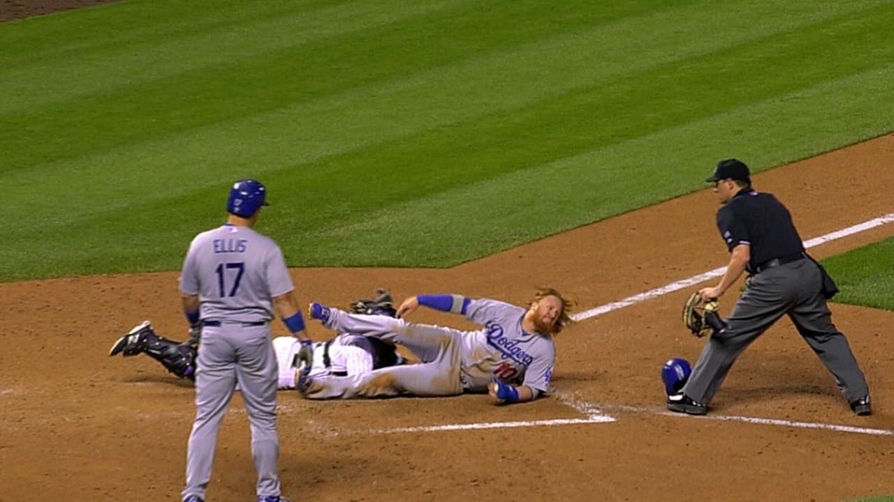 Turner out after plate-blocking review vs. Rockies