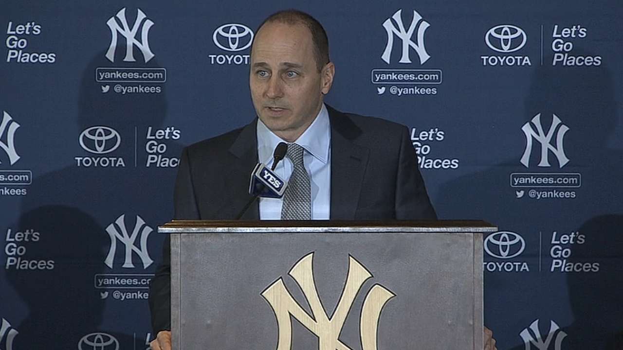 Cashman signs three-year deal to continue as GM