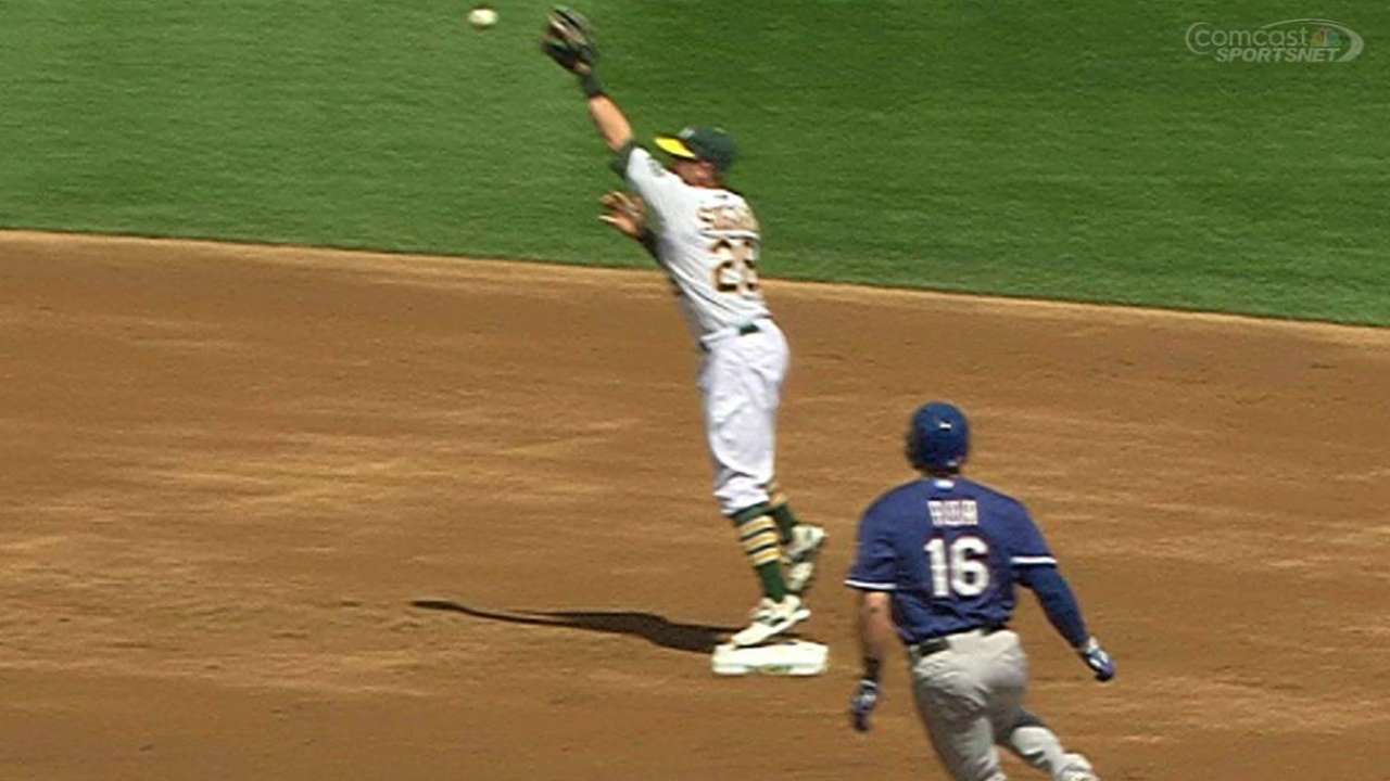 A's escape jam with wacky, replay-aided double play