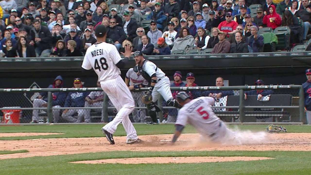 Escobar scores on a wild pitch