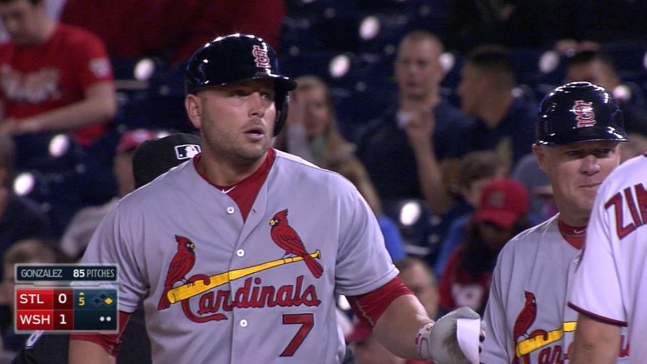 With four singles, Holliday's hitting streak at 12 games