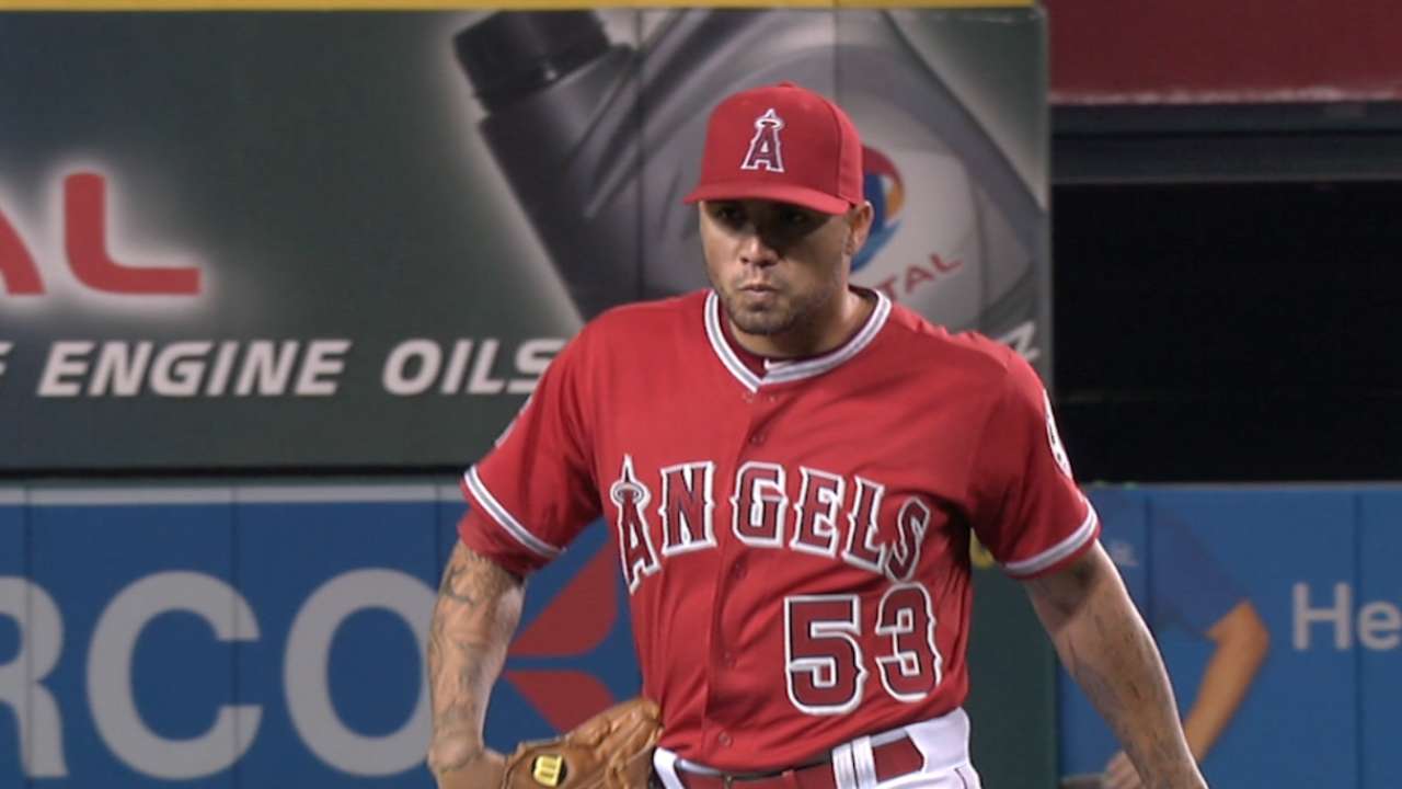 Santiago strikes out eight A's