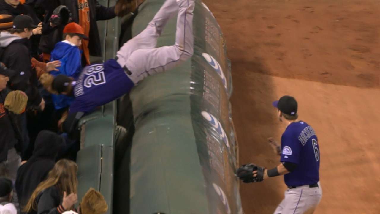Must C: Arenado flips over tarp