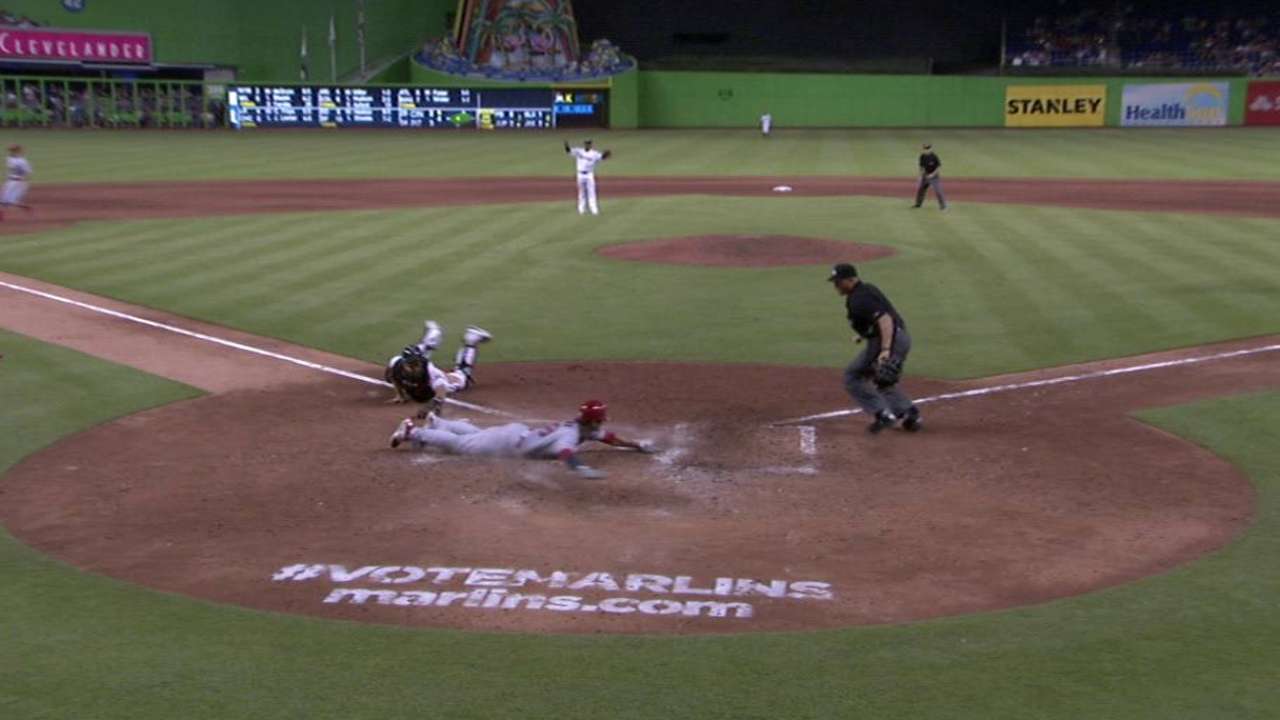 Kozma's head-first slide to home