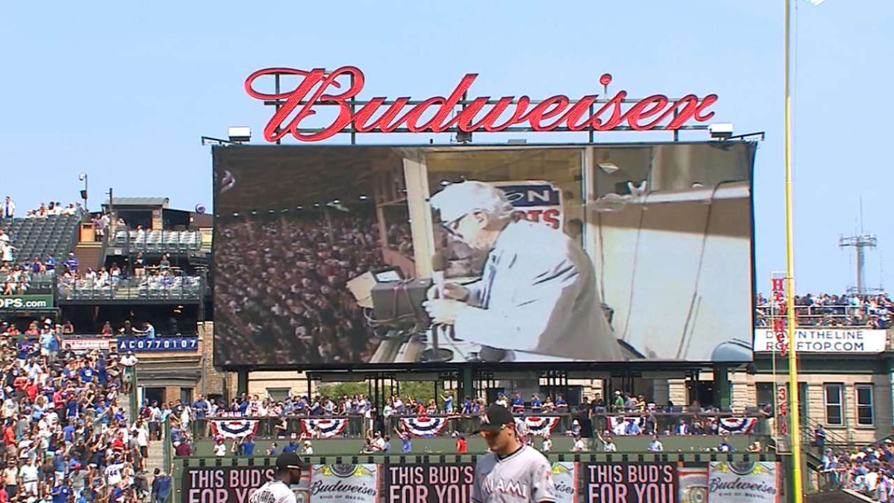 Caray sings during the 7th