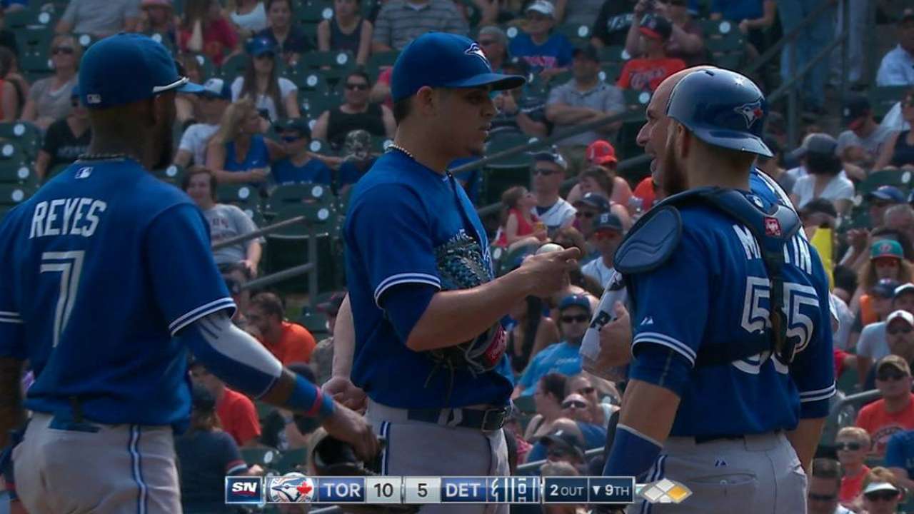 Osuna stays in game despite back injury