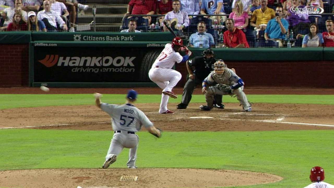 Phils advance on Wood's balk