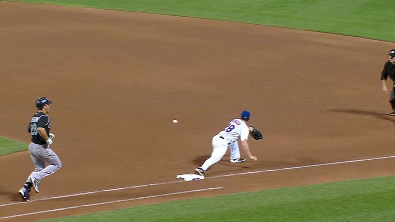 Arenado safe at first on review