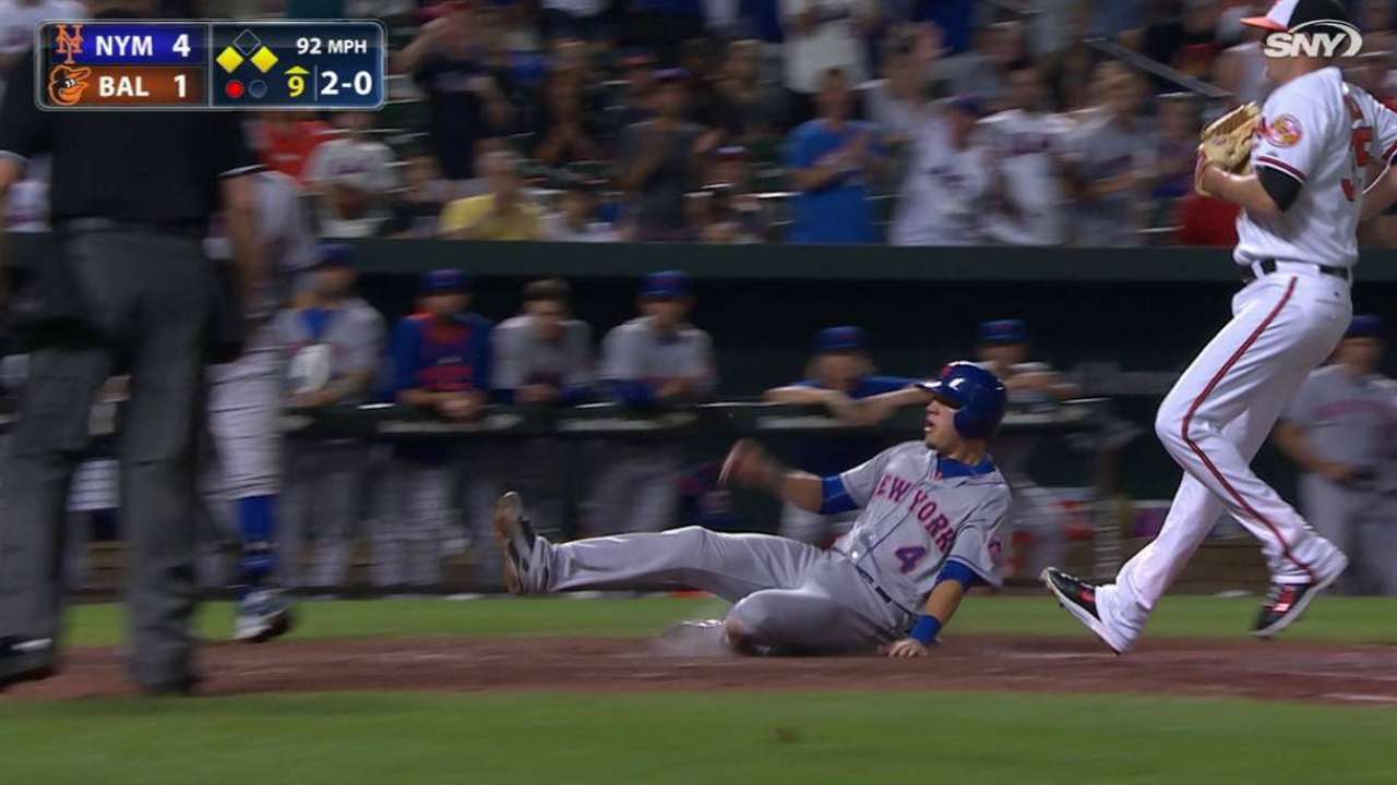 Flores scores on a wild pitch