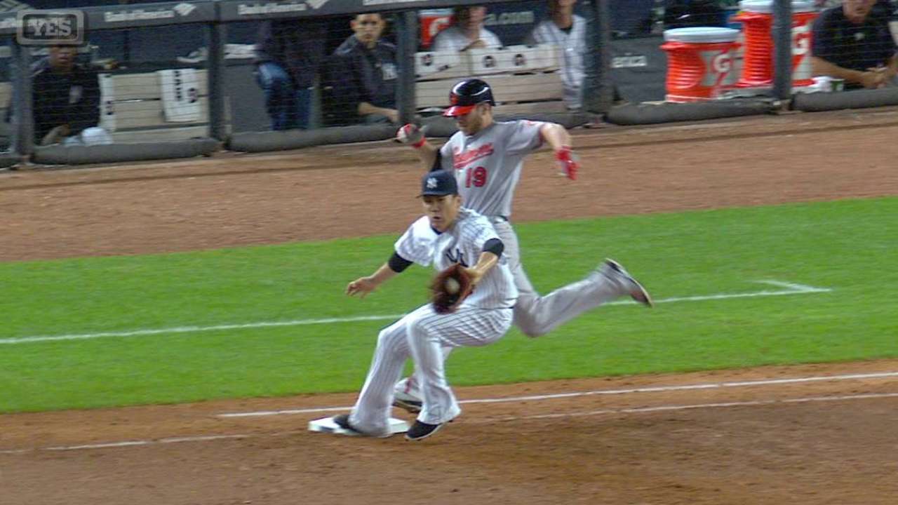Tanaka beats Davis to first