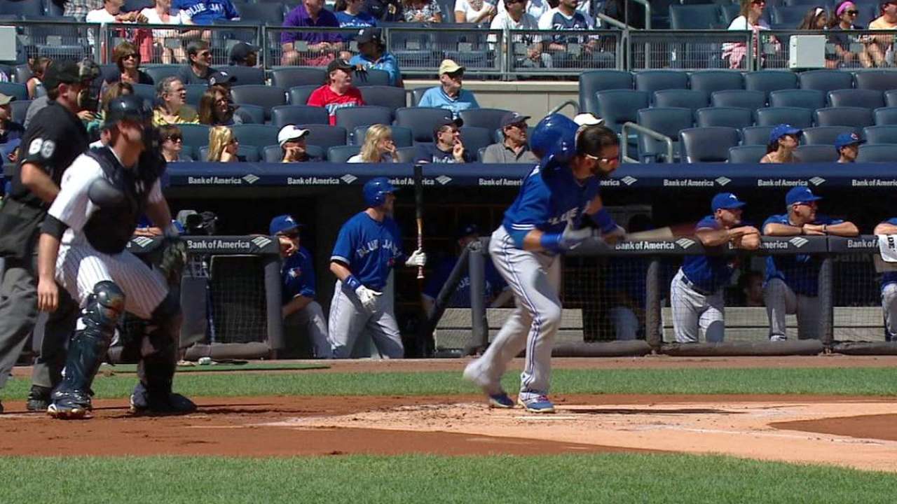 Bautista doubles, loses helmet