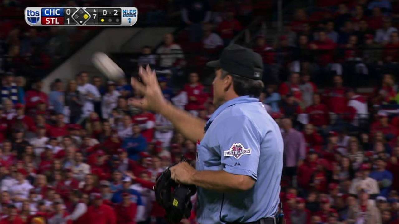 Umpire checks baseball