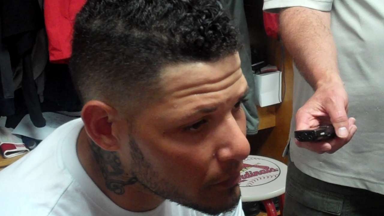 Yadi tested early by play at plate in debut