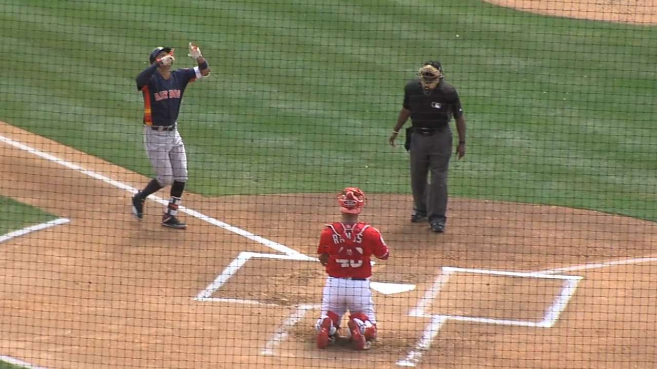 Correa's first homer backs strong Keuchel