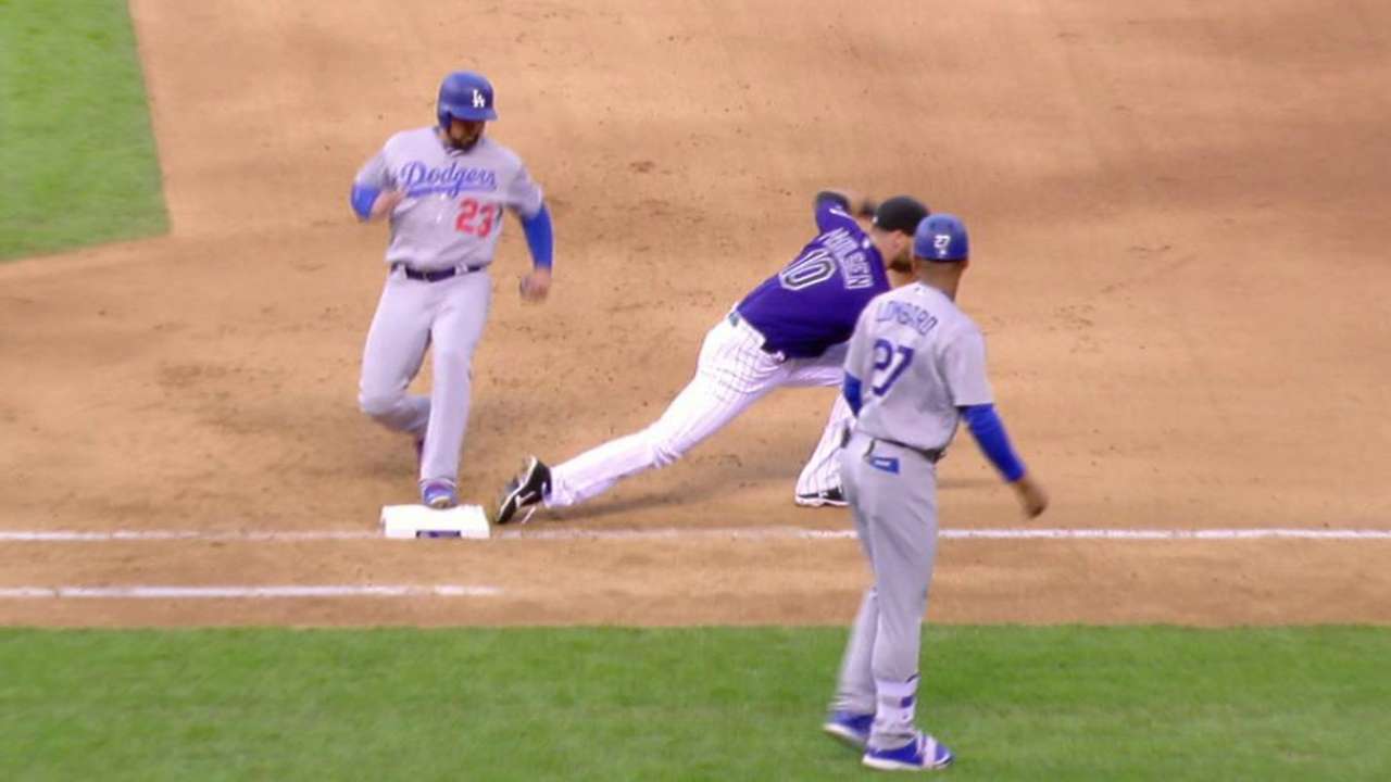 Gonzalez hustles back to first