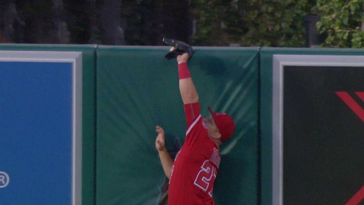 Trout robs Rickard at the wall