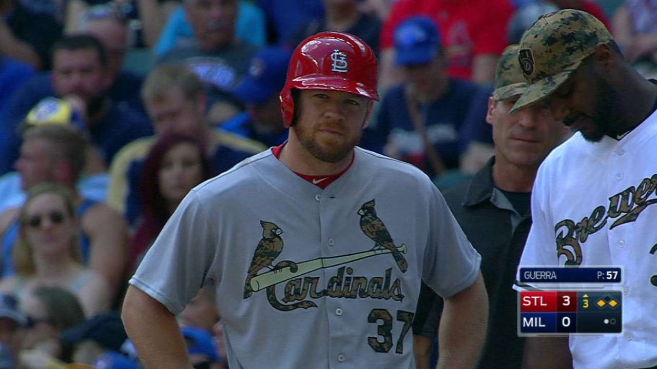 Holliday scores on wild pitch